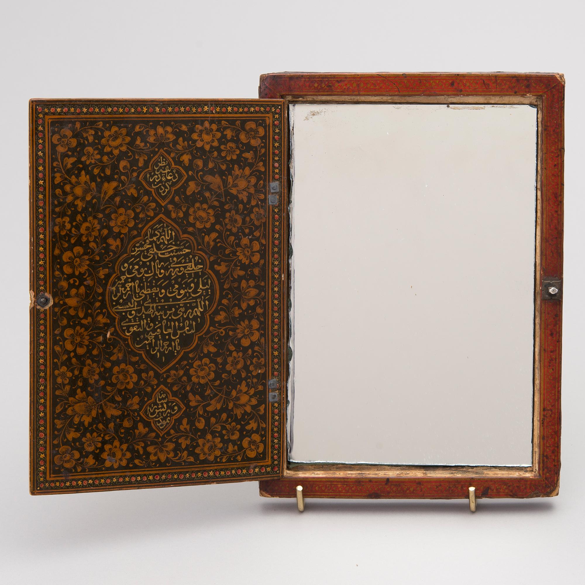 A 19th century polychrome lacquered papier maché mirror case, Qajar, Iran.
