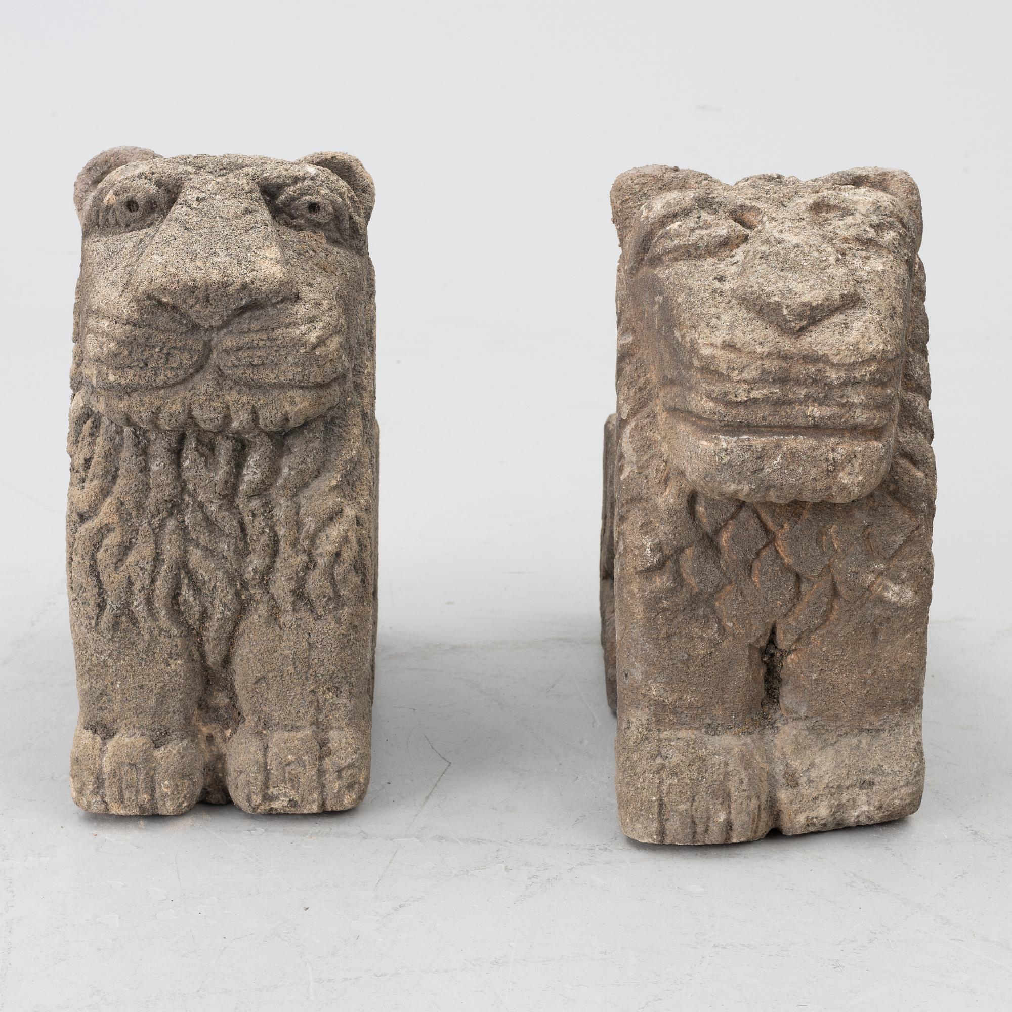 A set of two lion garden sculptures.
