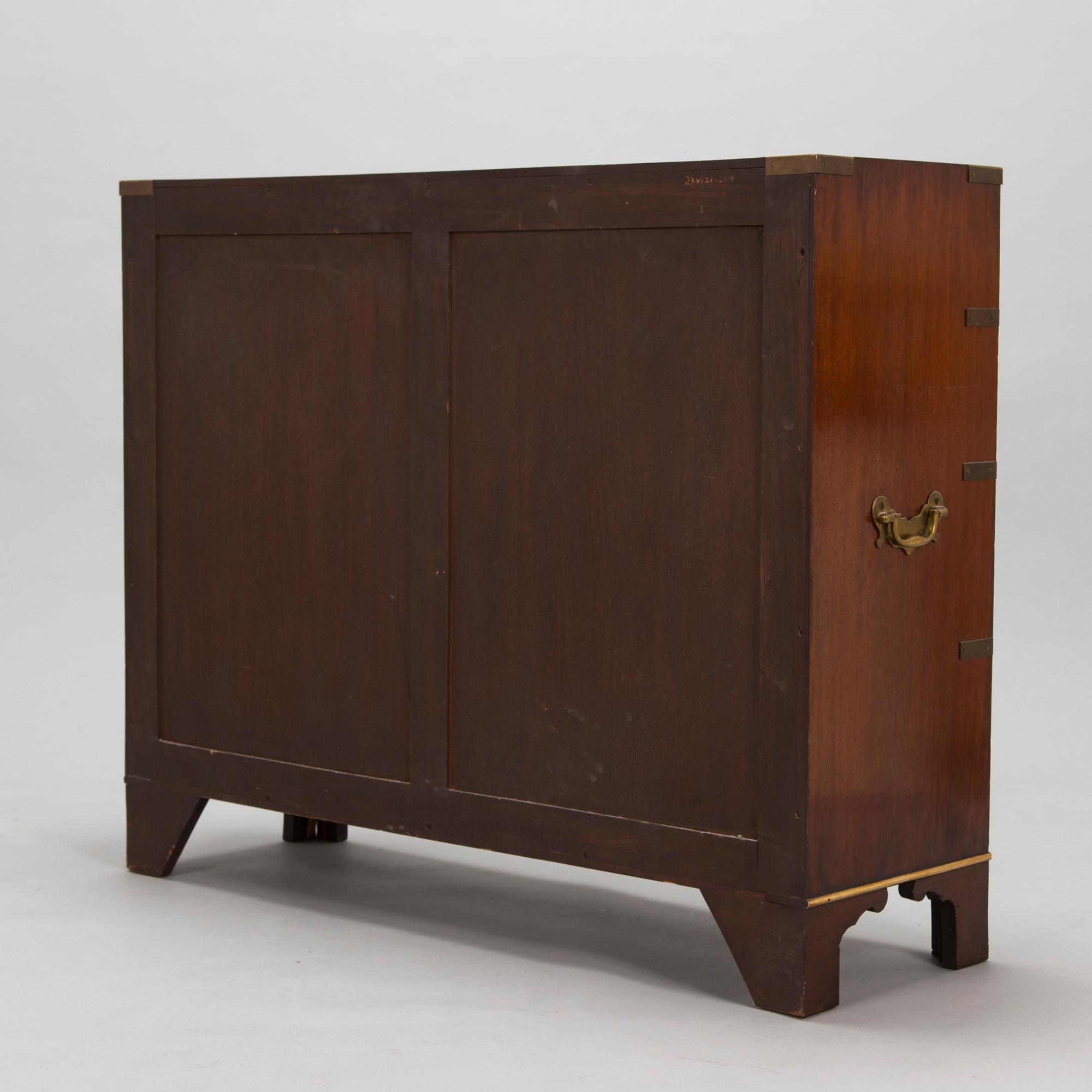 A chest of drawers, England, second half of the 20th century.