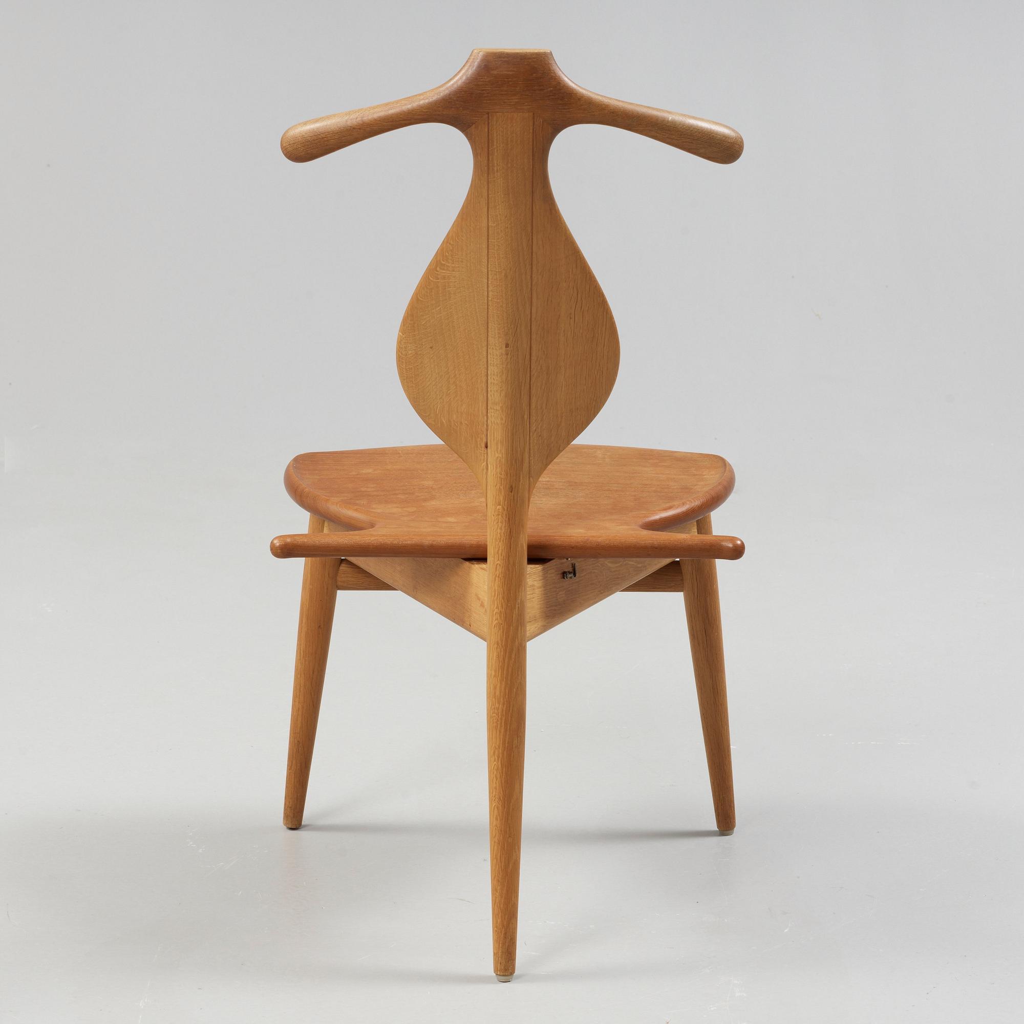 A Hans J Wegner 'Jakkens Hvile' teak chair, Johannes Hansen, Denmark.
