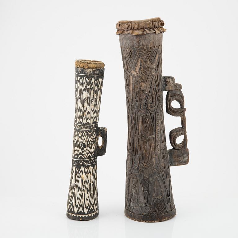 Two wooden Asmat drums, Indonesia, Jakarta, 20th Century.