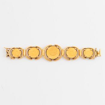 An 18K gold bracelet set with Mexican 22K gold coins.