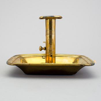 A 19th century brass candlestick.