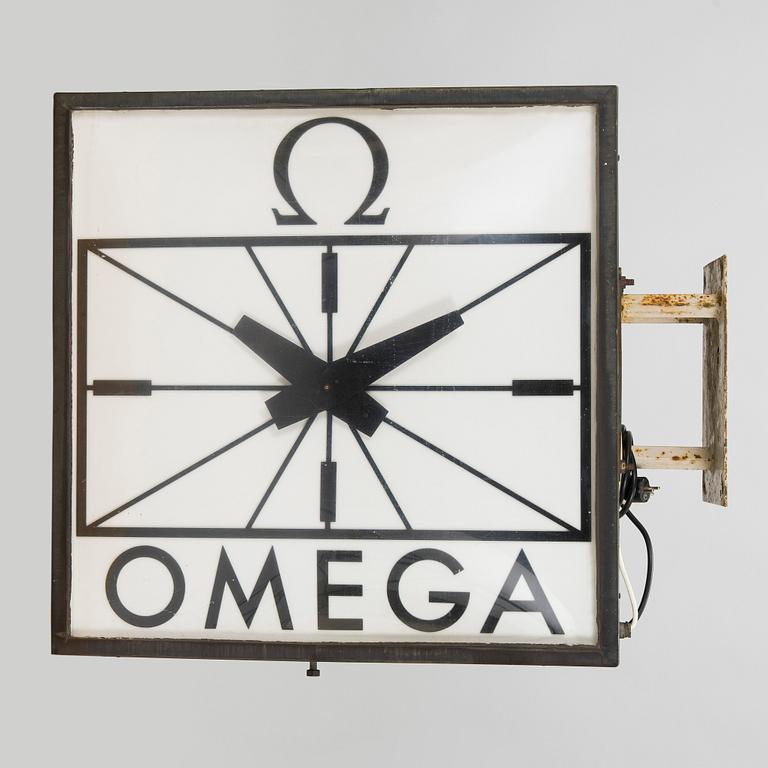 Reklamklocka, Omega, 1900-talets andra hälft.