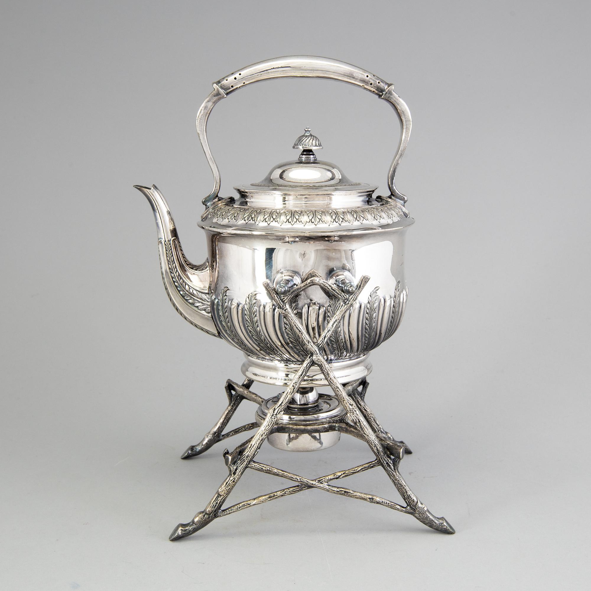 A 20th century tea pot on stand by Walker & Hall, Sheffield, England.