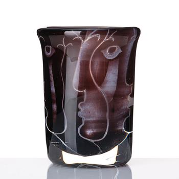 Ingeborg Lundin, an 'ariel' burgundy coloured glass vase decorated with faces, Orrefors Sweden 1972.