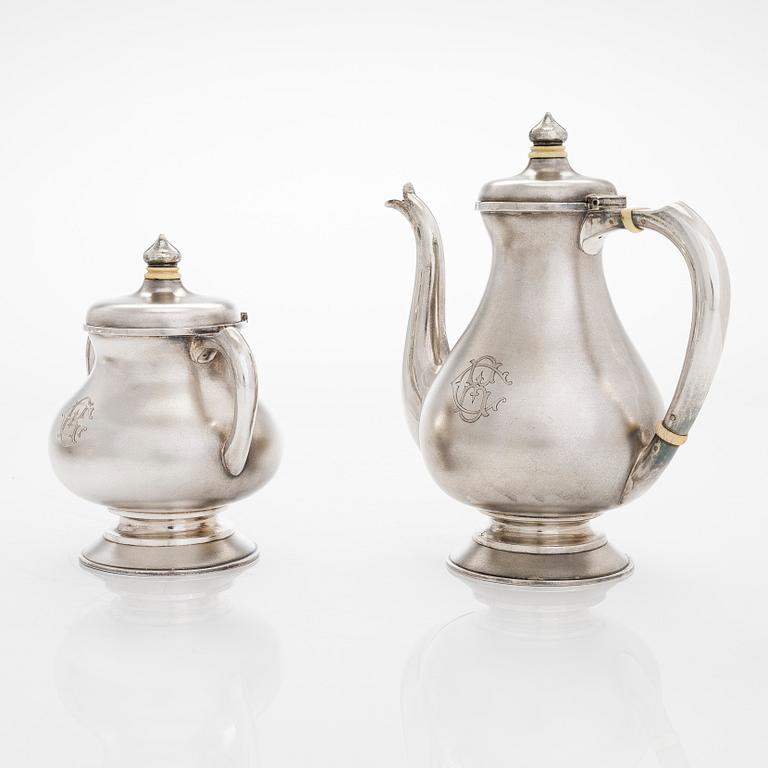A four-piece silver coffee set, St. Petersburg 1887, original fitted box from Khlebnikov. Sugar tong, Moscow around 190.