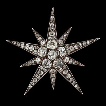 1124. An antique cut diamond star brooch, tot. app. 8.50 cts. C. 1880.