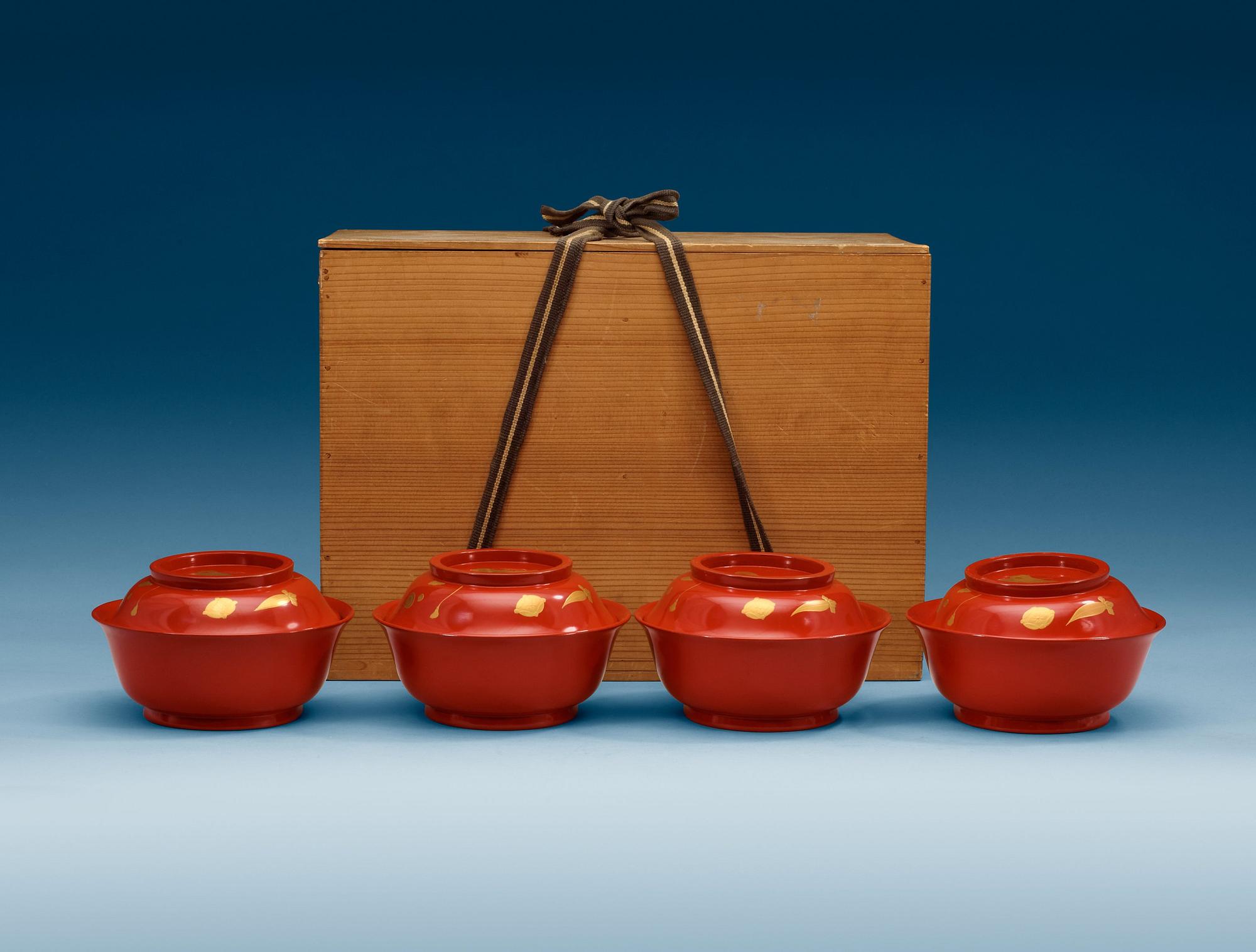 A set of eight red lacquered Japanese bowls with covers, first half of 20th Century.