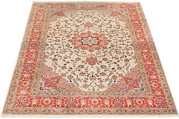 A Tabriz carpet, part silk, 50 raj, c. 304 x 204 cm.