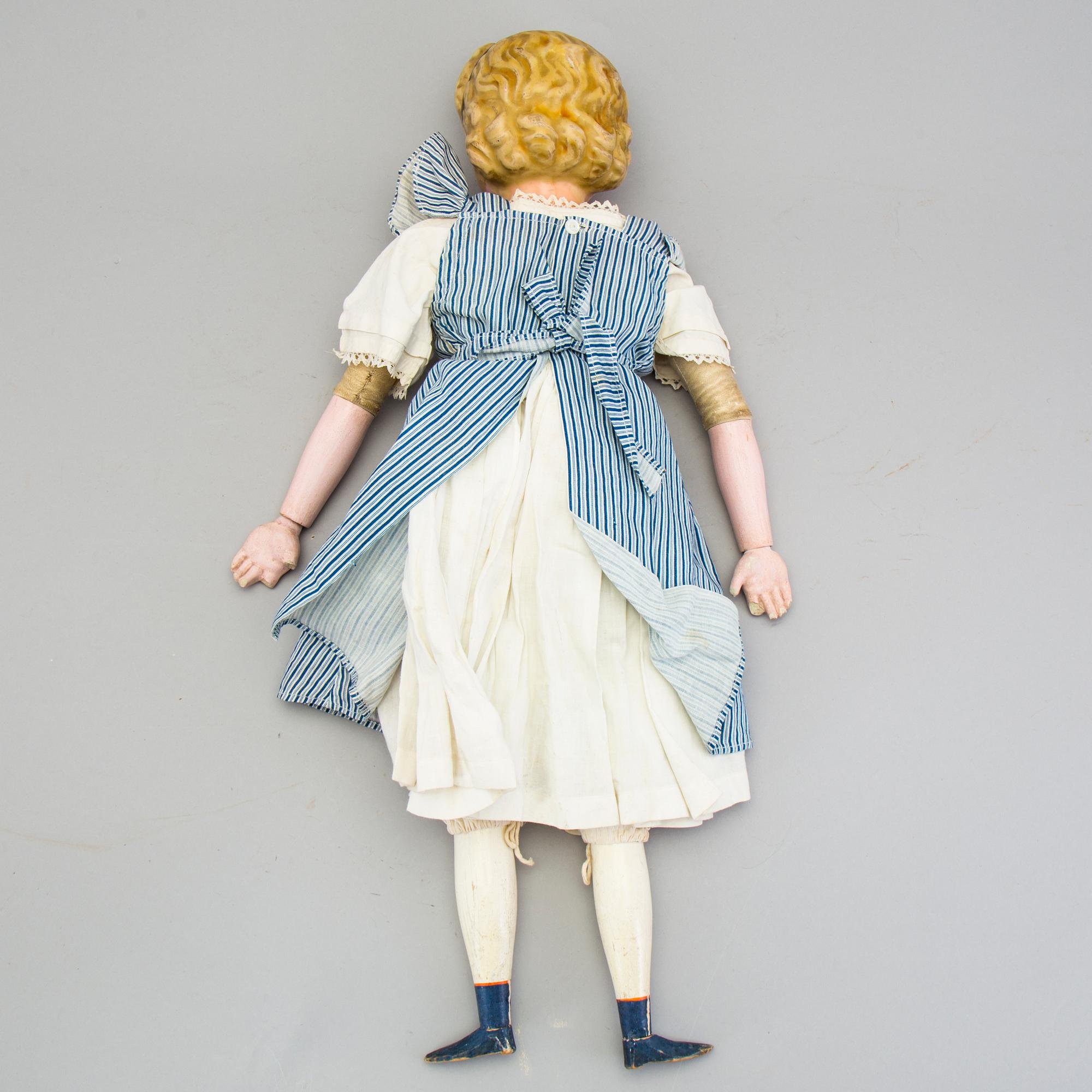A Wax over papier Mache doll. "Alice in Wonderland". Second half of the 19th century.