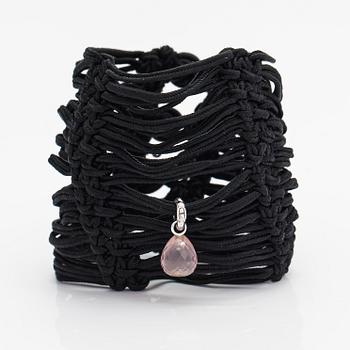 Ole Lynggaard, A satin like band bracelet with an 18K white gold and rose quartz "Sweet drops" pendant.