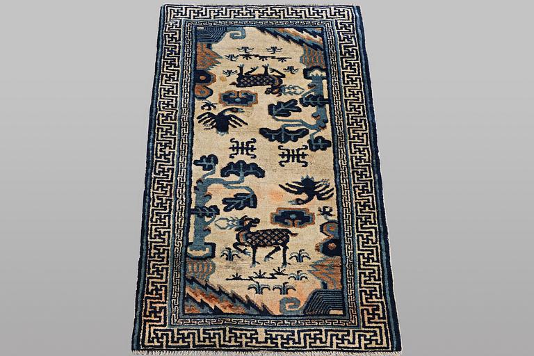 A rug, old, China, ca 125 x 60 cm.
