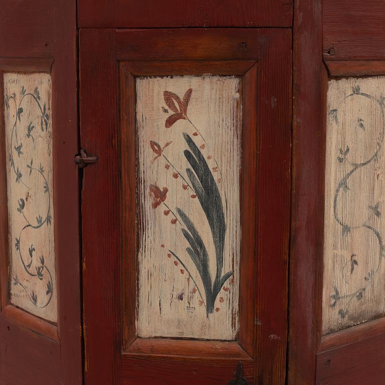 A painted corner cabinet, 19th century.