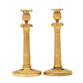 A pair of Empire early 19th century candlesticks. Signed GF.