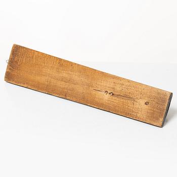 A painted wooden mangle board, dated 1831.