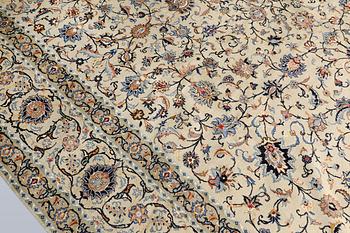 A Keshan carpet, signed, approx. 410 x 323 cm.