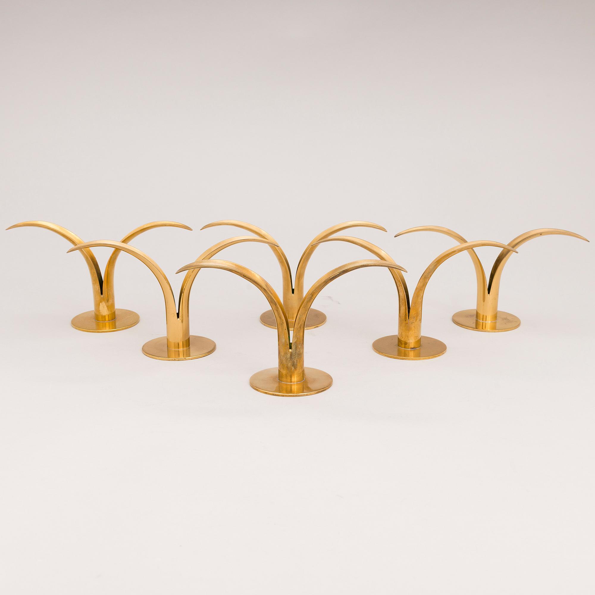 Six brass candle sticks "Liljan" by Ivar Ålenius-Björk for Ystad metall, second half of the 20th century.