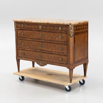 A Louis XVI-style marquetry and marble commode, later part of the 19th century.
