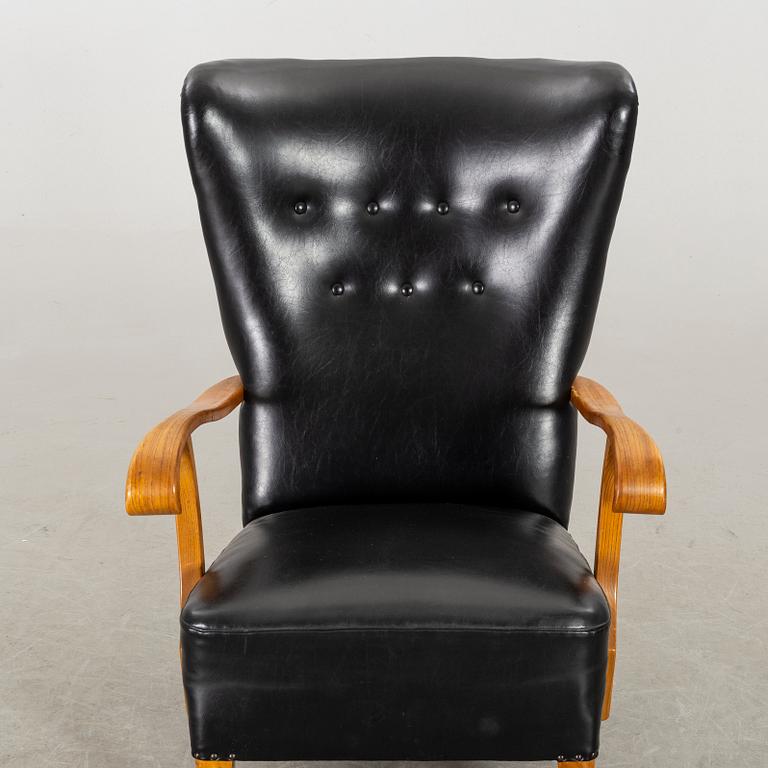 A 1940's - 50's easy chair in black leather, Scandinavian.