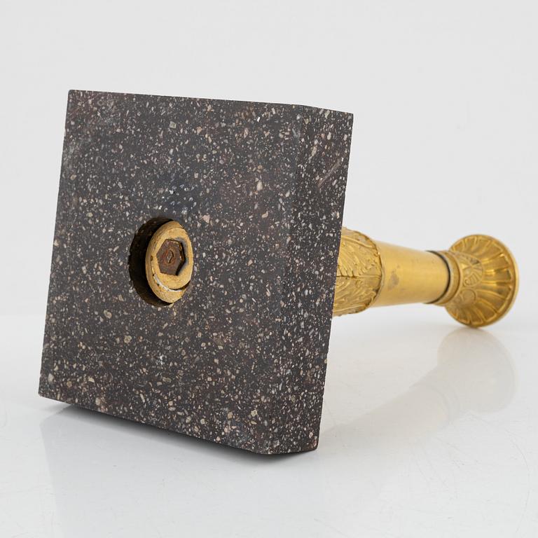 A bronze and porphyry candlestick, 20th Century.