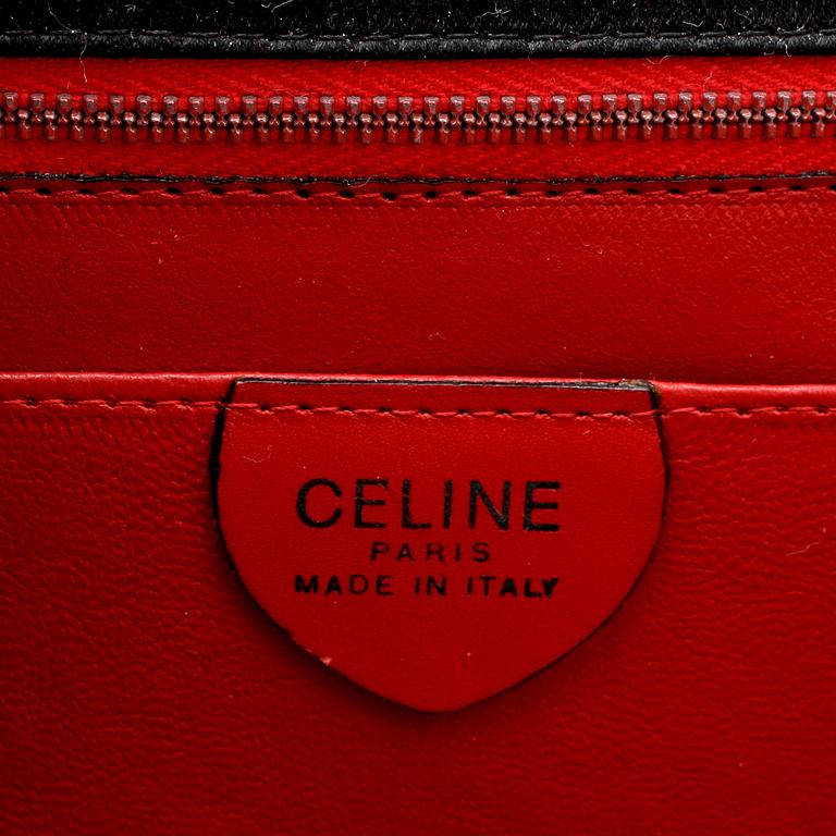 CÉLINE, a black satin eveningbag / clutch.
