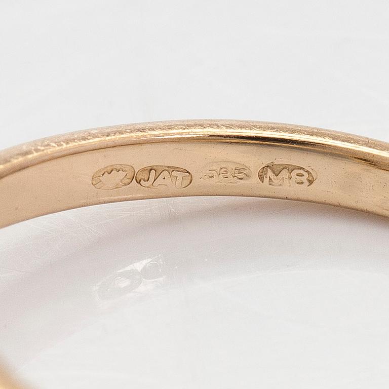 A 14K gold ring with old-cut diamonds.