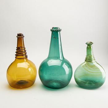 A group of five persian glass bottles and a ball, 19th/20th Century.