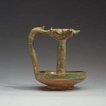 AN OIL LAMP, pottery with turquoise glaze. Height 21,5  cm. Persia (Iran), possibly Kashan 13th century.