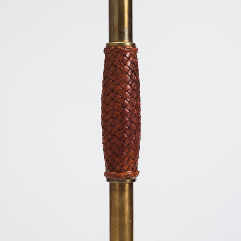 Carl-Axel Acking, a brass and leather floor lamp, designed for the Stockholm Association of Crafts in 1939.