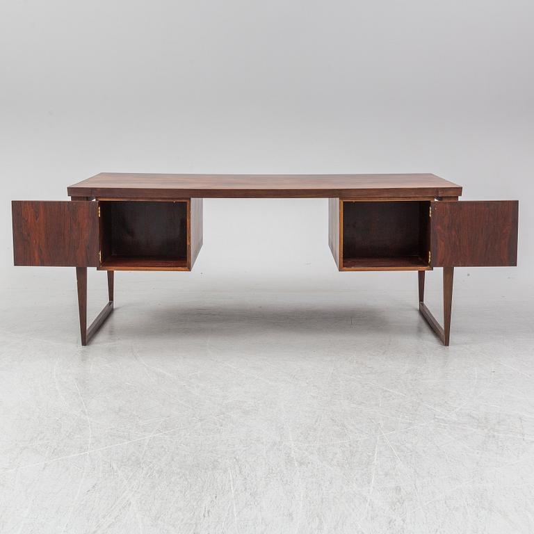 A 1960's rosewood desk by Kai Kristiansen, Feldballes Møbelfabrik, Denmark.