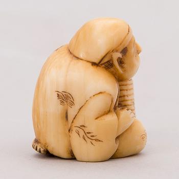 A 19th century Japanese bone netsuke.