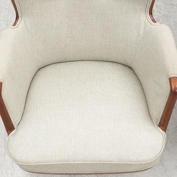 A pair of similar Swedish Modern armchairs, mid 20th century.