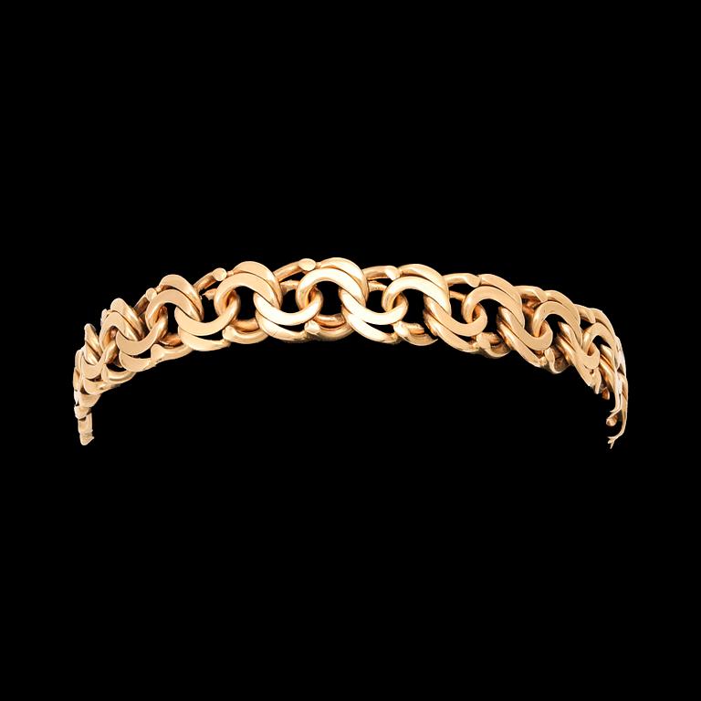 An 18K gold Bismarck bracelet.