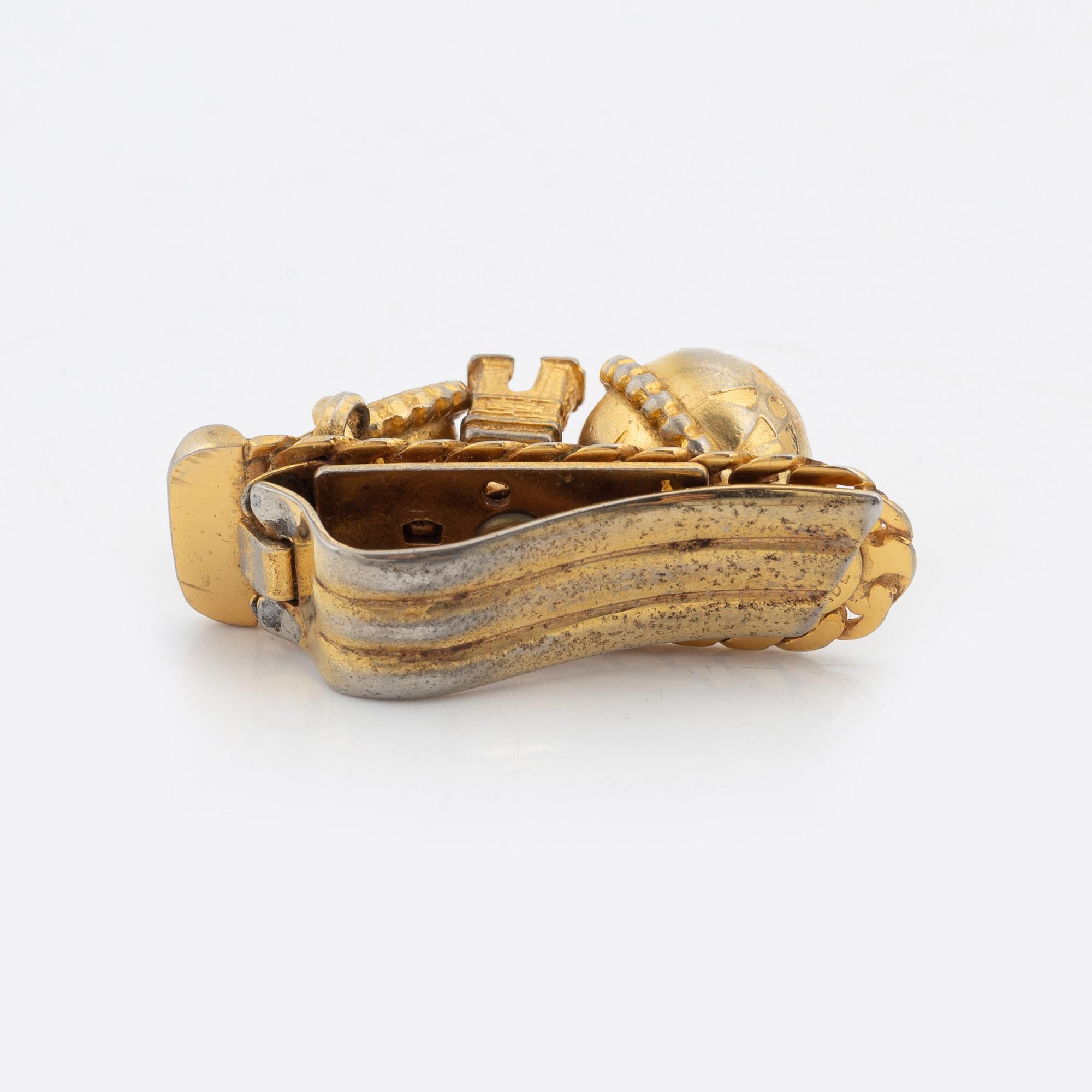 Céline, a set of four gold tone brooches.