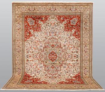 A carpet, figural Tabriz, so-called Tabatabai, approx. 380 x 282 cm.