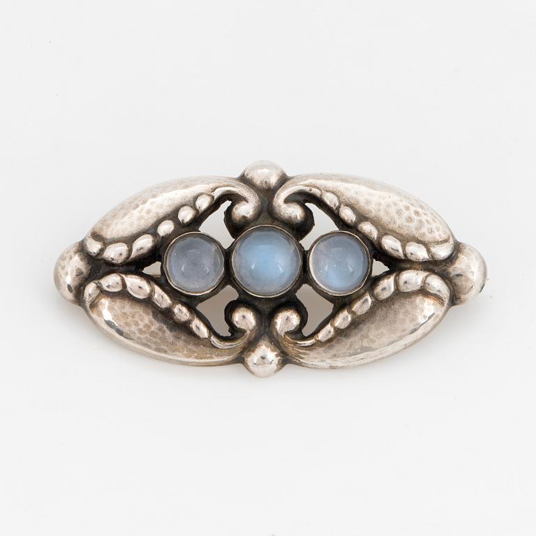 A Georg Jensen brooch silver set with moonstone.