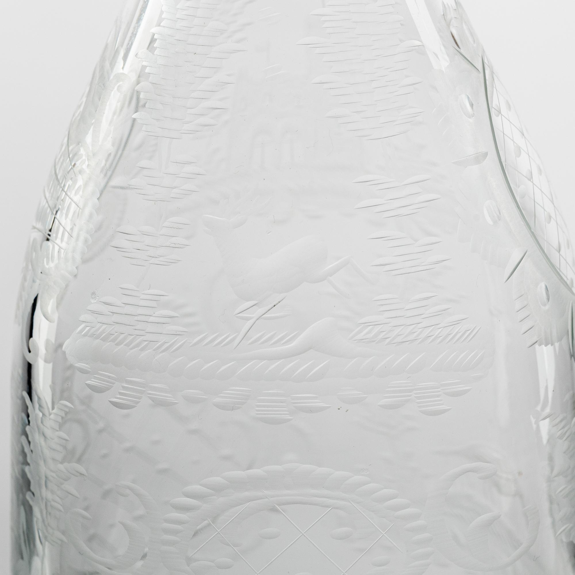 A set of three glass bottles and one decanter, 19th Century.