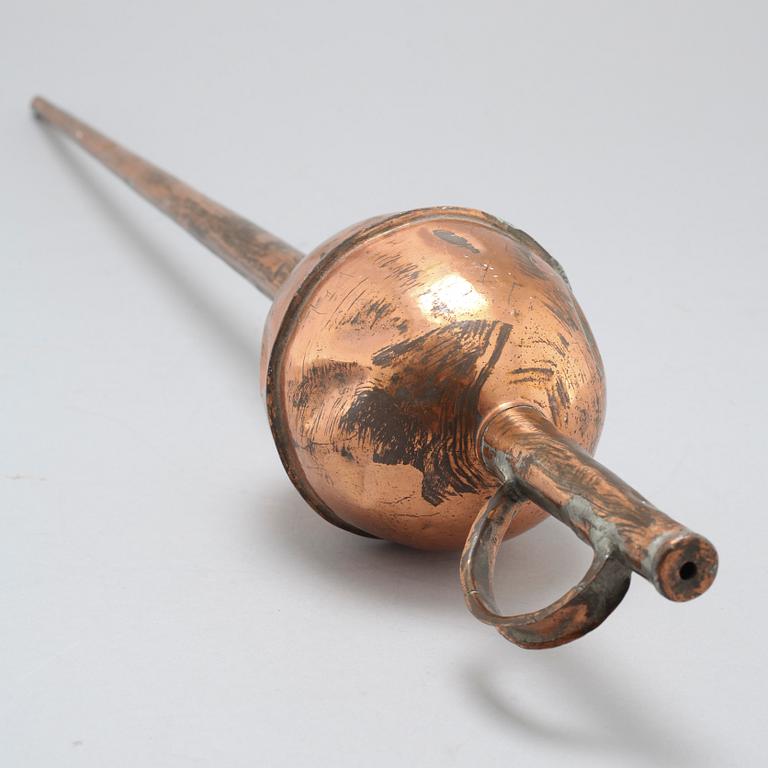 A 19th century pipette in copper.