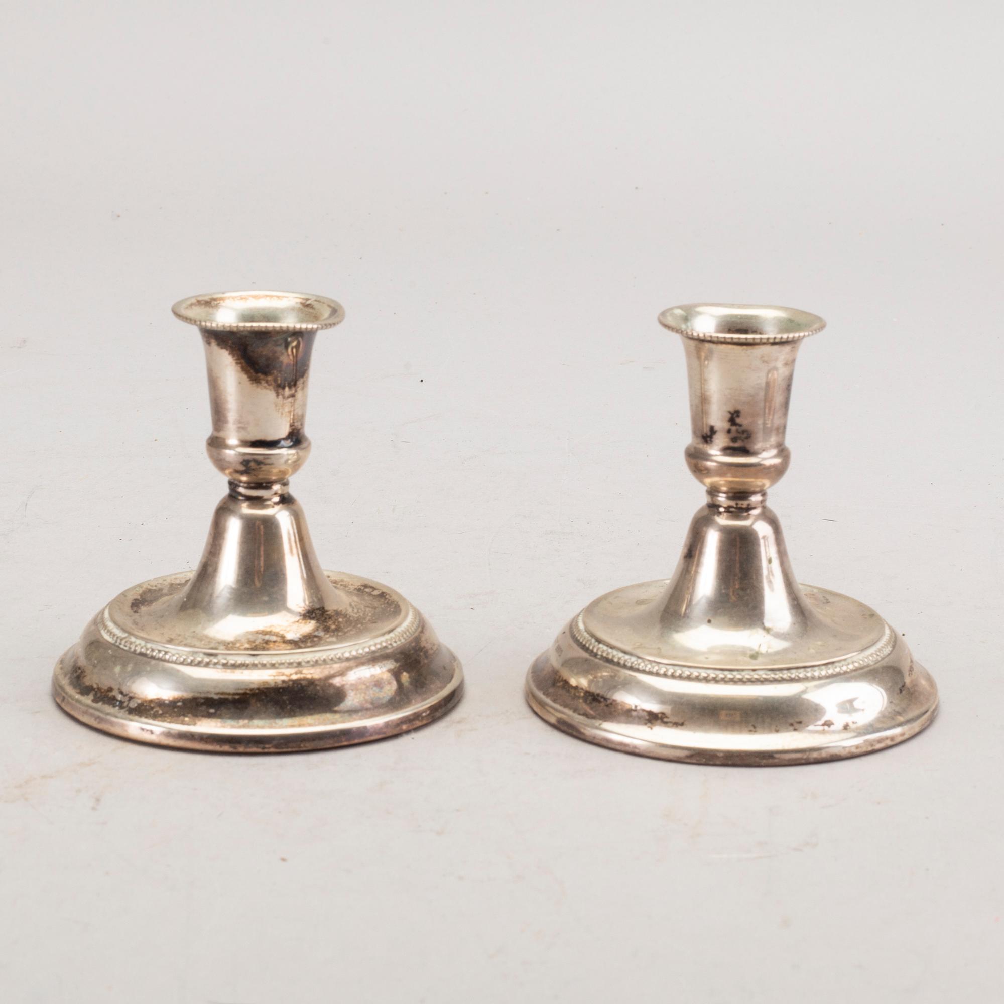 A set of three pair of Swedish 20th century silver candle sticks.