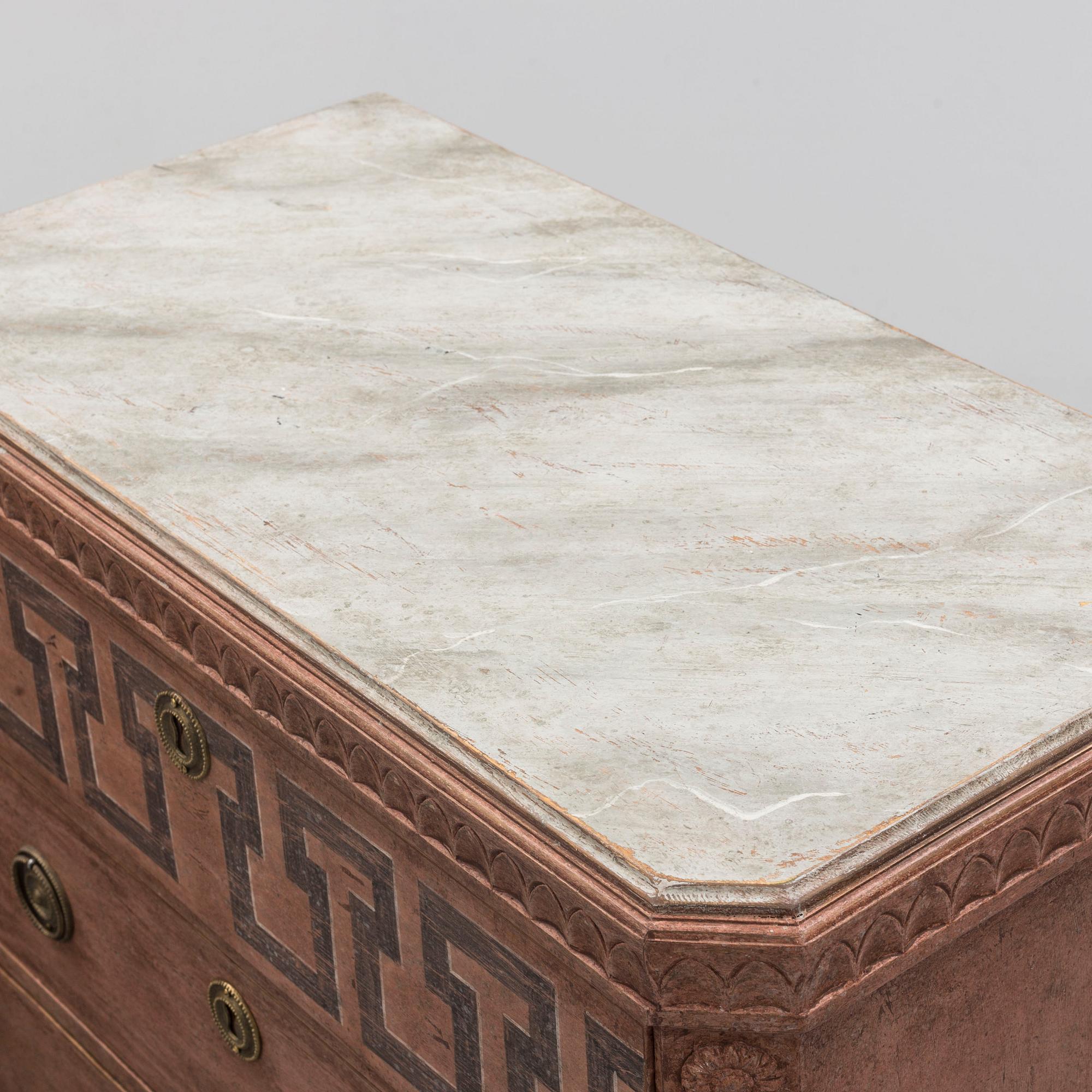 A pair of Gustavian style painted chest of drawers.