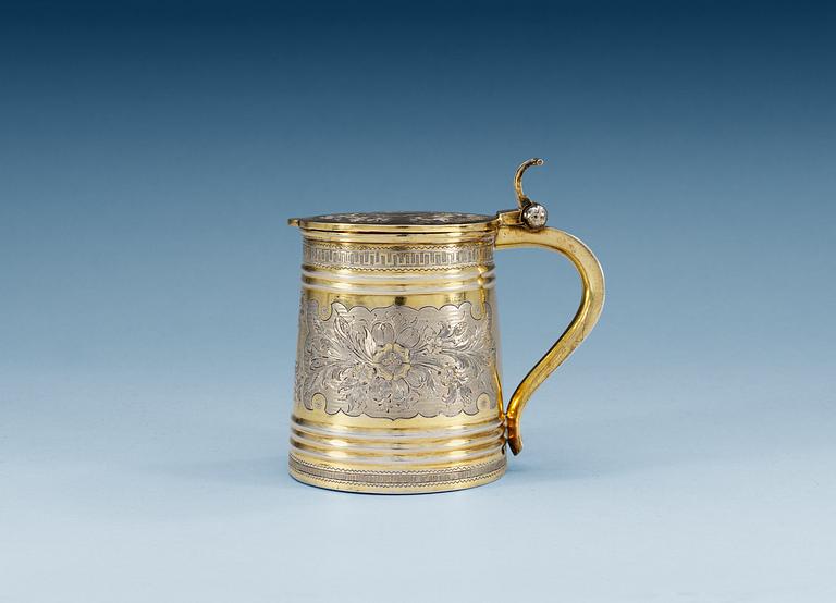 A RUSSIAN SILVER-GILT TANKARD, unidentified makers mark, Moscow 1874.