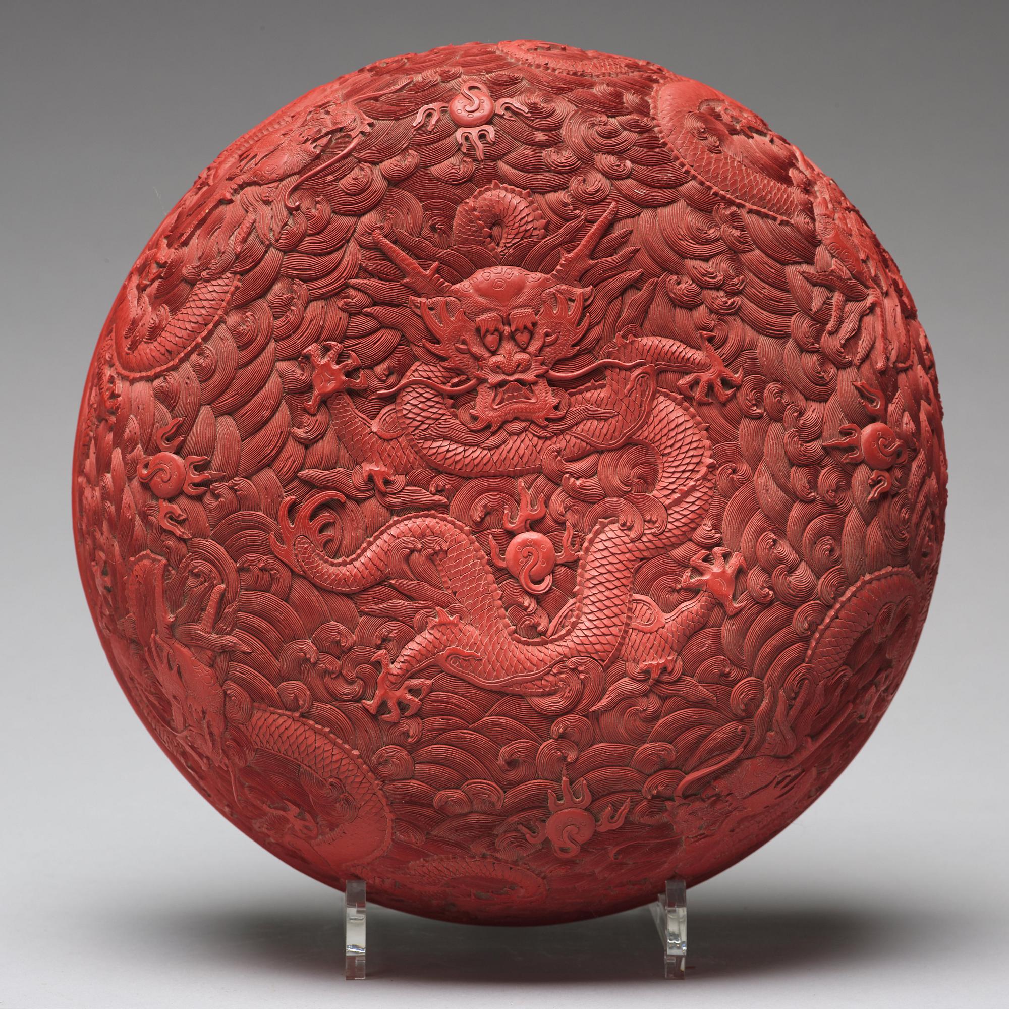 A carved red dragon box with cover, Qing dynasty (1662-1912).