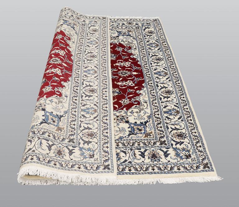A rug, Nain part silk, ca 208 x 149 cm.