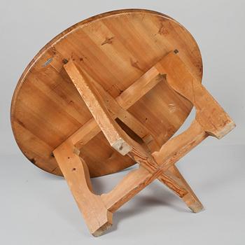 A stained pine dining table, attributed to Axel Einar Hjorth, Nordiska Kompaniet, 1930's.