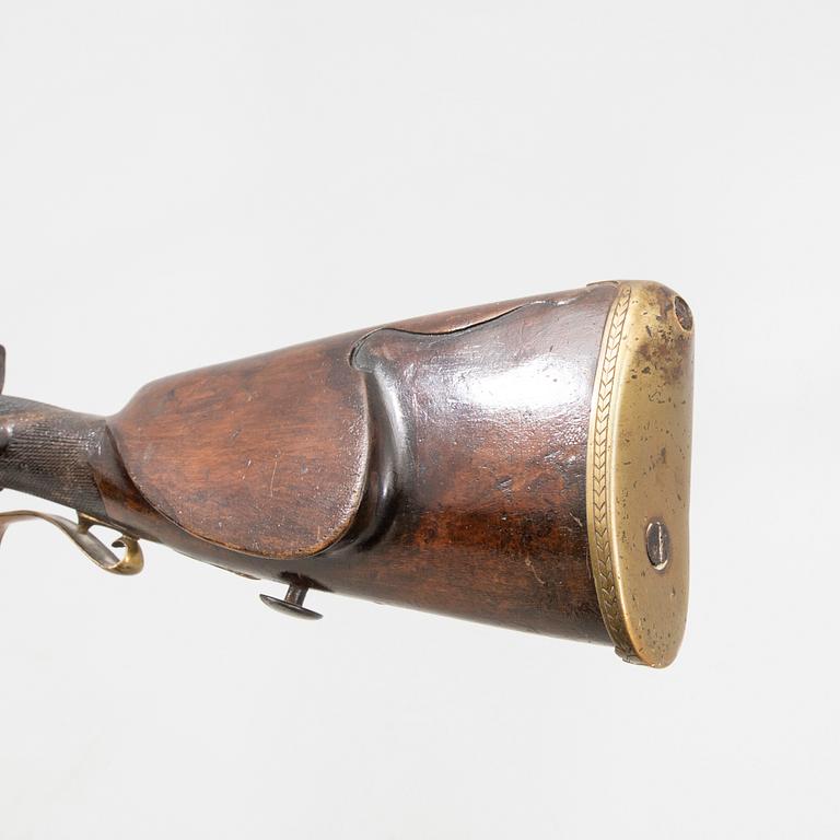 A double barreled percussion gun, 19th century.