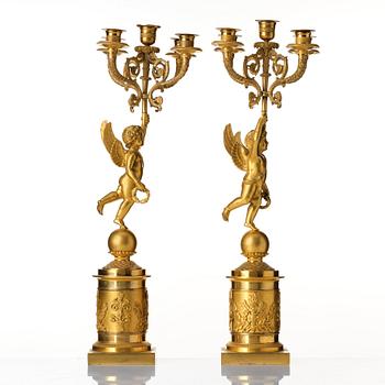 A pair of Empire five lights candelabra.