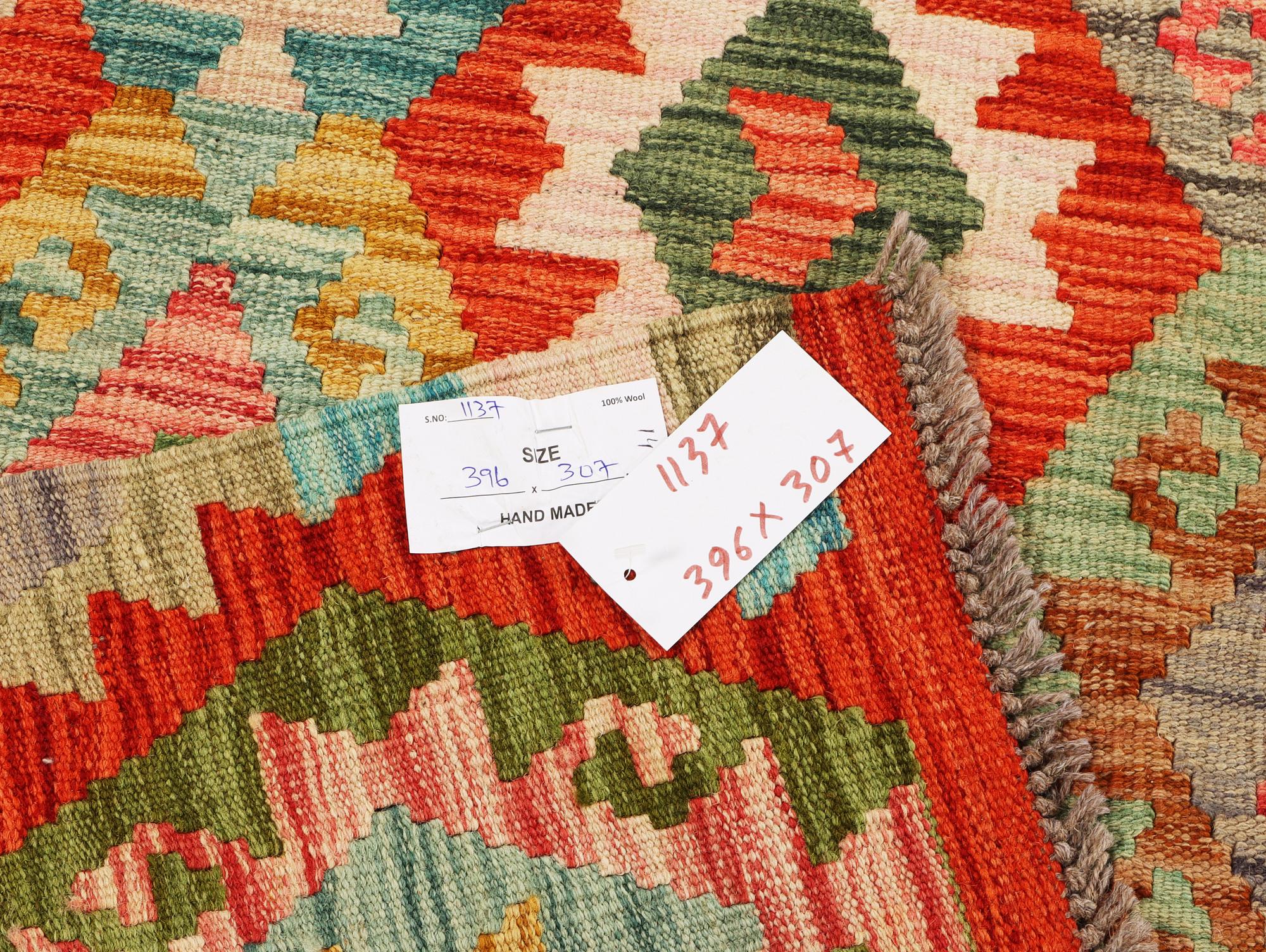 A Kilim carpet, c. 396 x 307 cm.