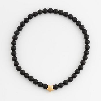 Ole Lynggaard, black stone  bead necklace, clasp star 18K gold with brilliant cut diamond.
