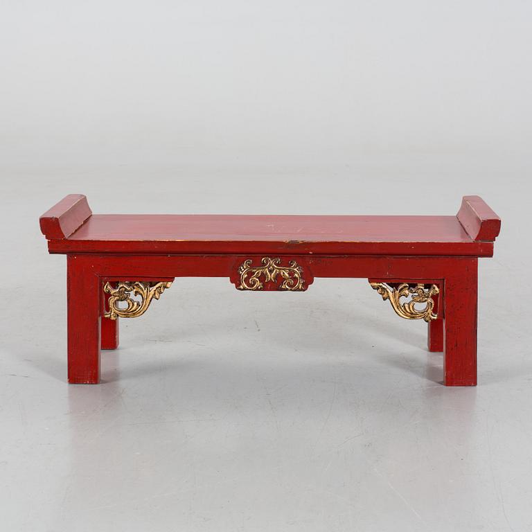 A Chinese 20th century painted wooden bench.